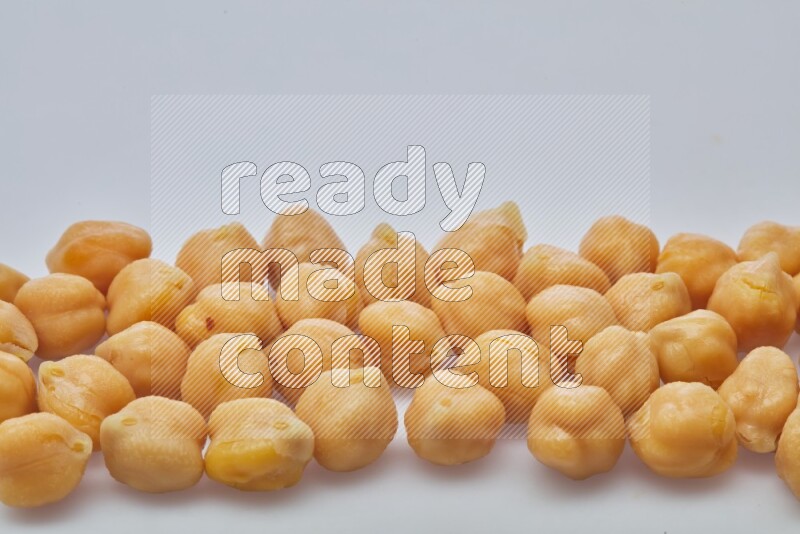 Close up shot of boiled chickpeas on white background