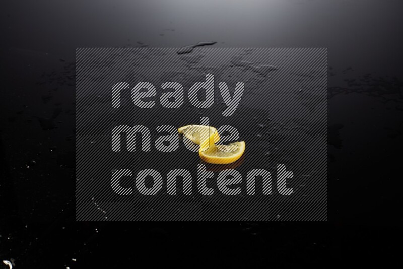 Lemon slice on black background