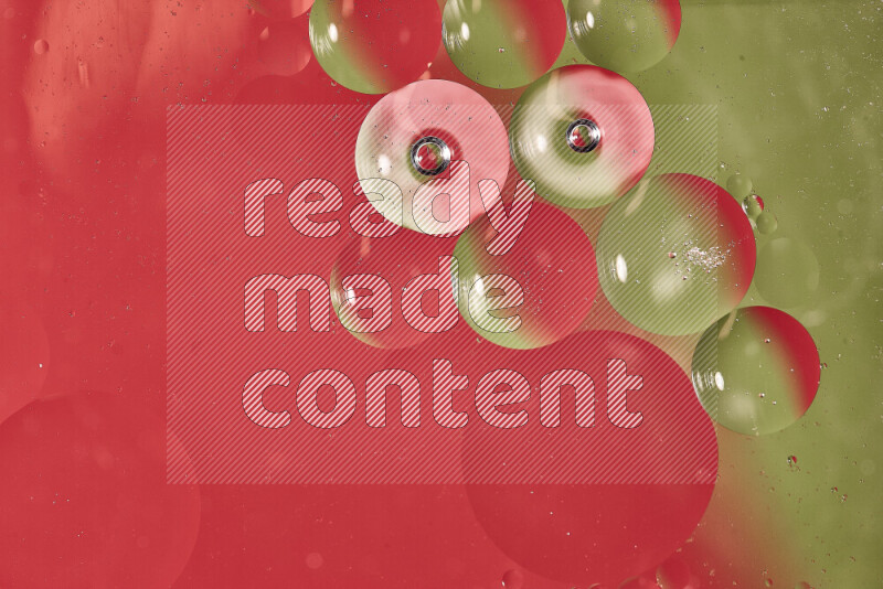 Close-ups of abstract oil bubbles on water surface in shades of green and red