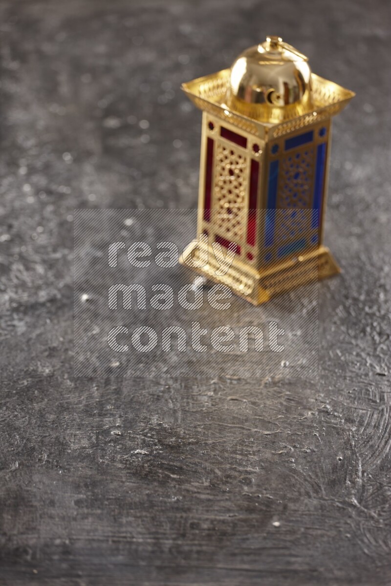 An out of focus lantern on textured black background