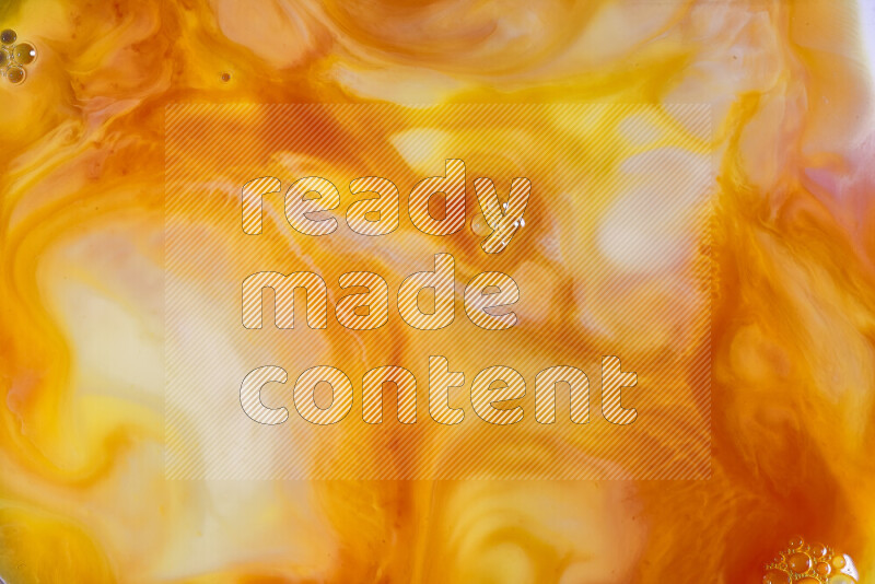 A close-up of abstract different swirling patterns in orange