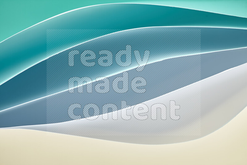 هذه الصورة تعرض تكوين فن الورق التجريدي مع منحنيات ورقية بتدرجات اللون الأخضر ودرجات دافئة مختلفة مكونه بواسطة الضوء الملون