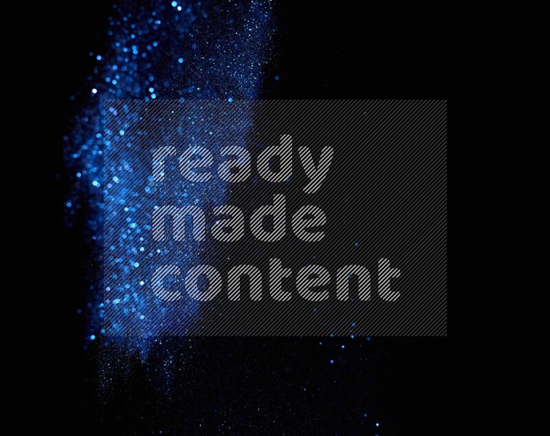 Blue glitter powder isolated on black background