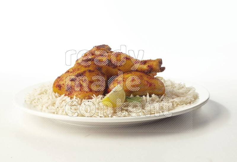 white  basmati Rice with  kabsa chicken pieces  on a white rounded plate direct on white background