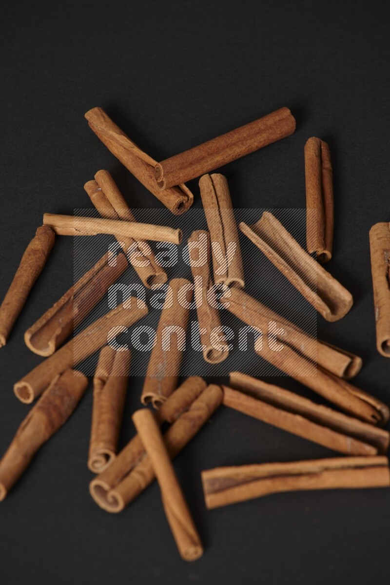 Cinnamon sticks on black background