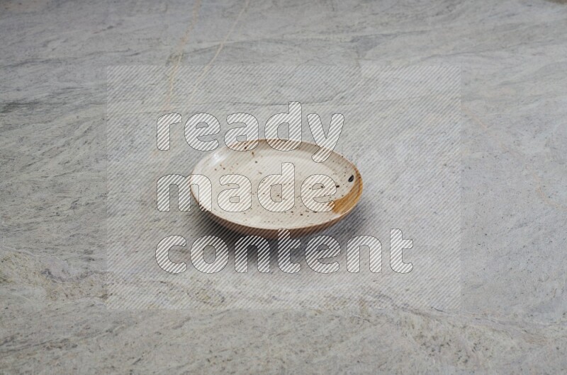 Multicolored Pottery Plate On Grey Marble Flooring