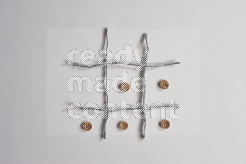 Brown buttons placed on grey background