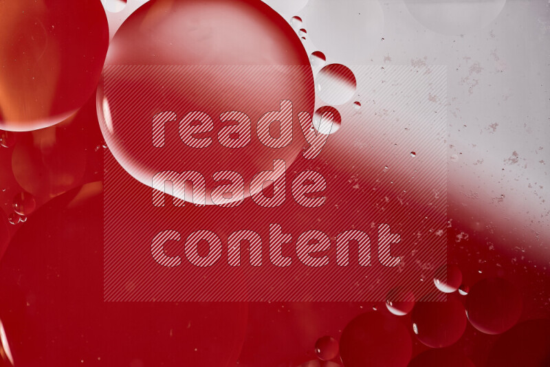 Close-ups of abstract oil bubbles on water surface in shades of white and red
