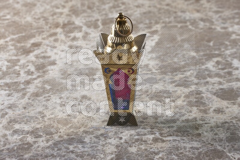 A lantern placed on a beige marble background