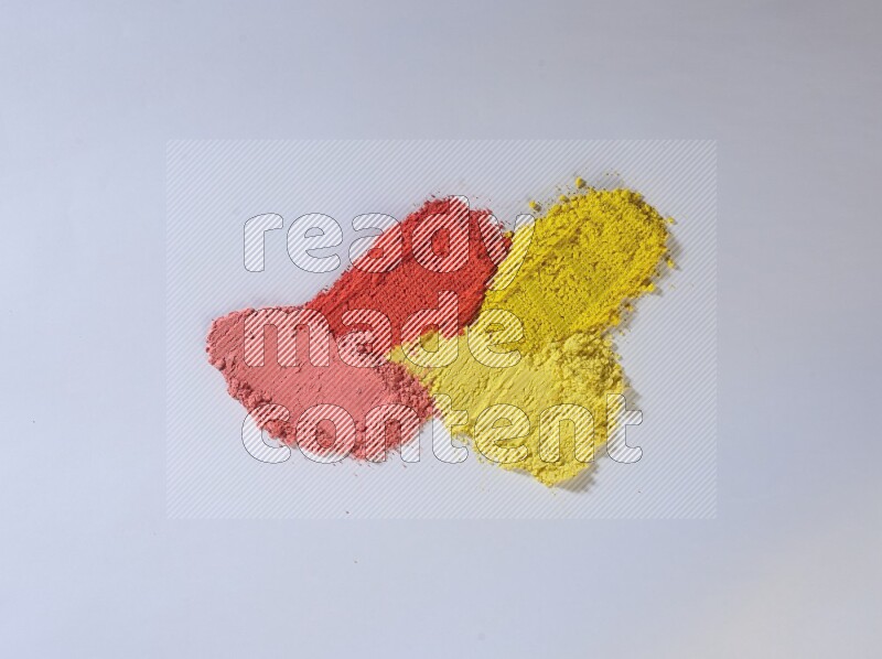 Multicolored powder smears on white background