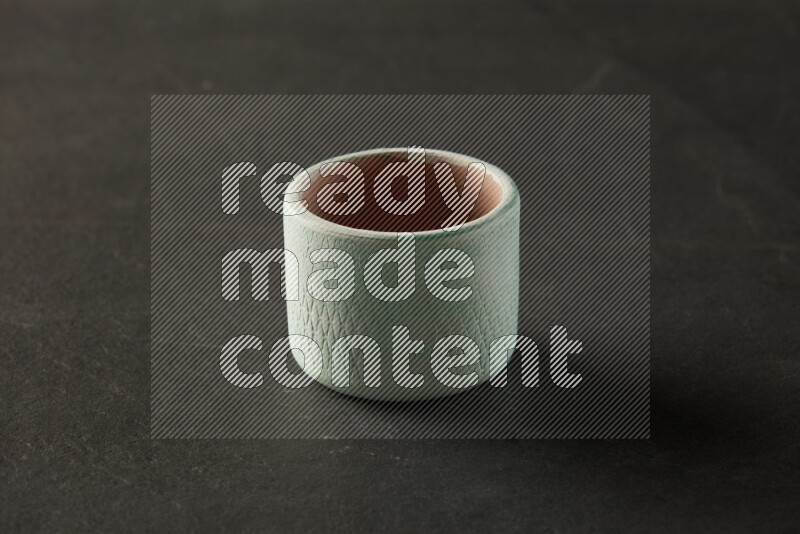 multi color round bowl on grey textured countertop