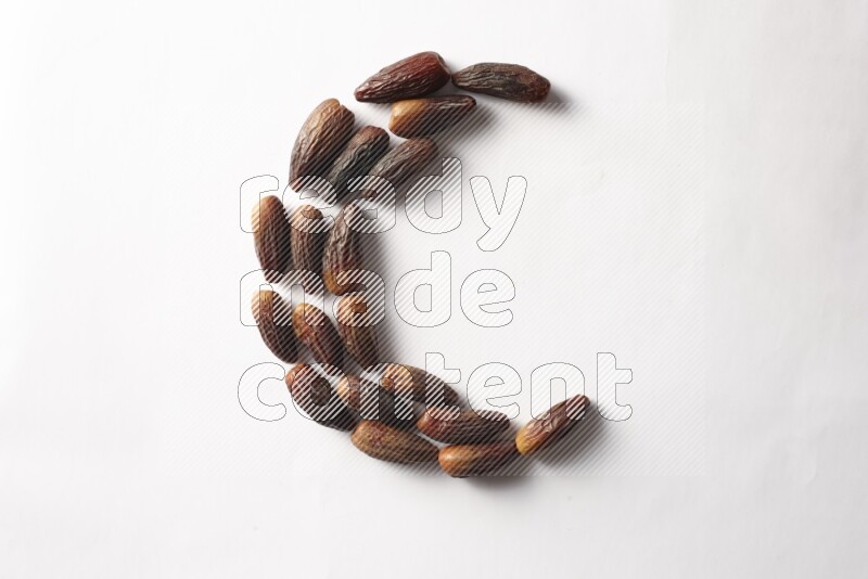 Dates in a crescent shape on white background