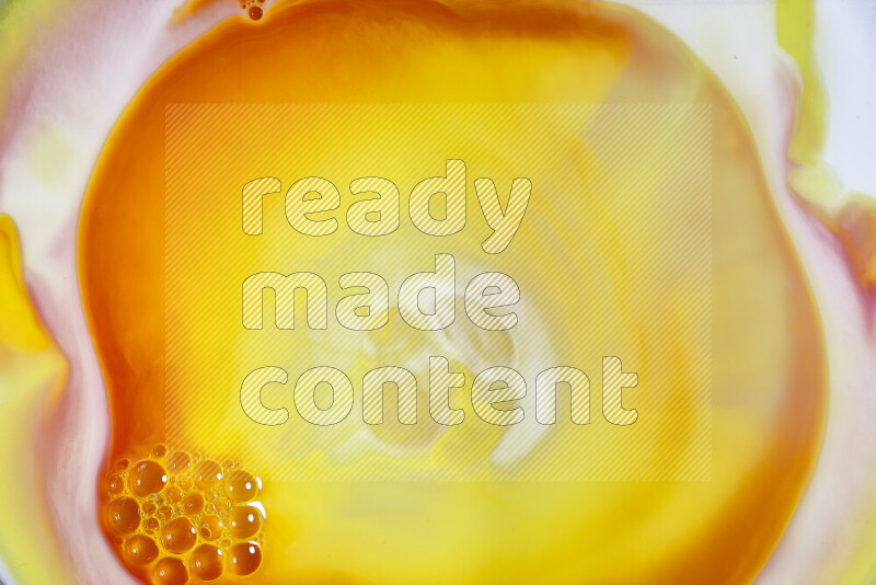 A close-up of abstract swirling patterns in orange, red and white