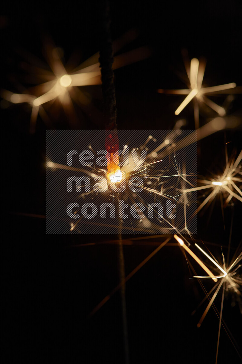 A close-up image of sparkler candle isolated on black background