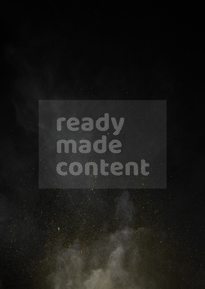 A side view of yellow powder explosion on black background