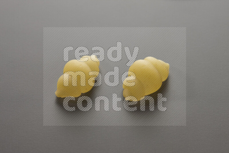 Snails pasta on grey background