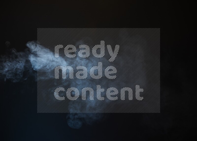 Heavy smoke in blue isolated on black background