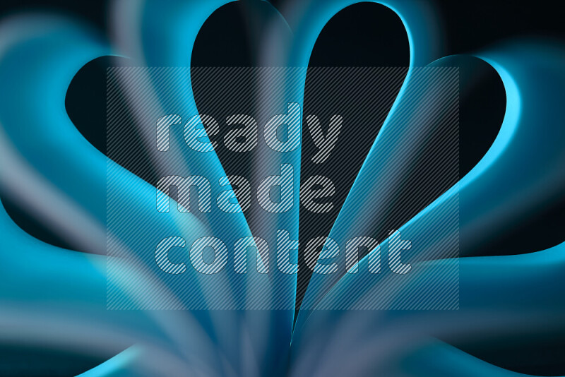 An abstract art piece displaying smooth curves in blue gradients created by colored light