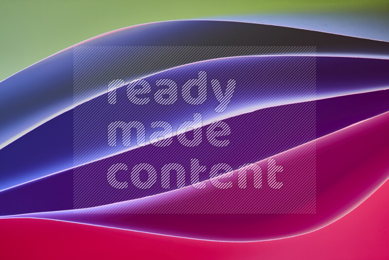 هذه الصورة تعرض تكوين فن الورق التجريدي مع منحنيات ورقية بتدرجات باردة ودافئة مختلفة مكونه بواسطة الضوء الملون