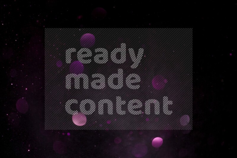 Pink glitter powder isolated on black background