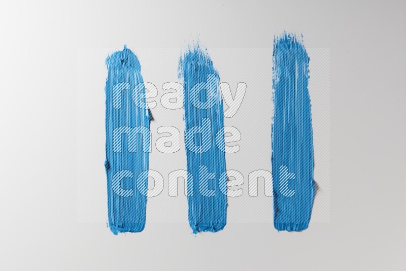 Blue painting brush strokes on white background