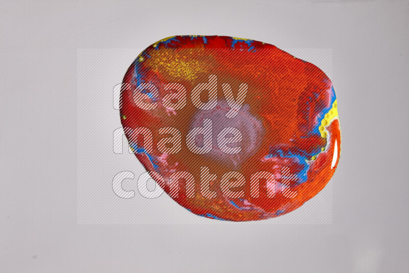 Close-ups of assorted colors blending on a grey background