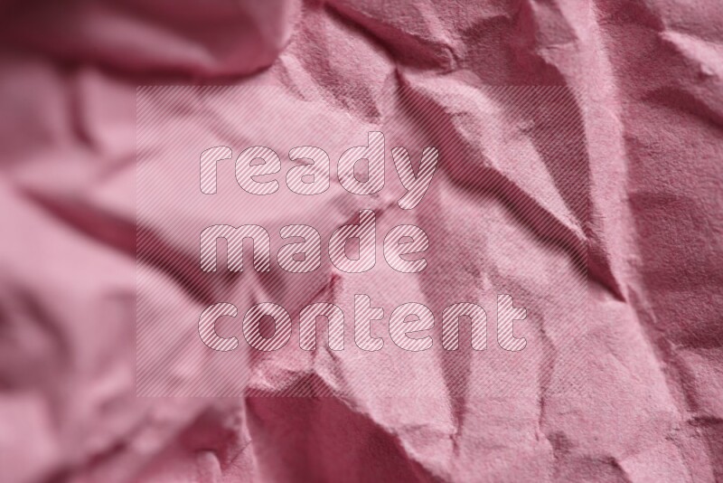 Crumpled craft paper on black background
