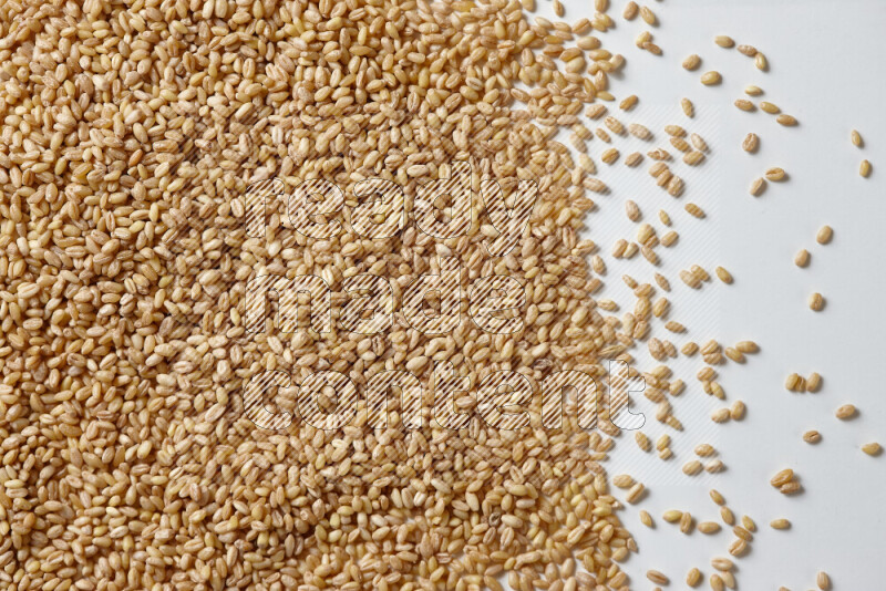 Hulled wheat on white background