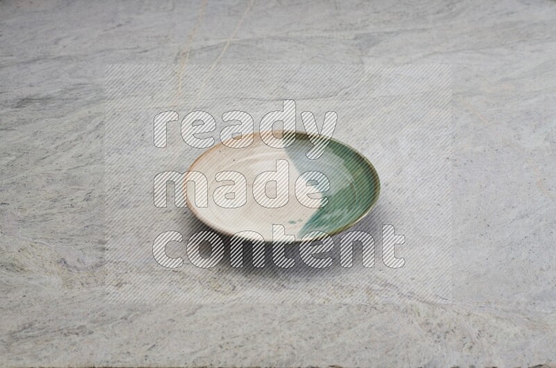 Decorative Pottery Plate On Grey Marble Flooring