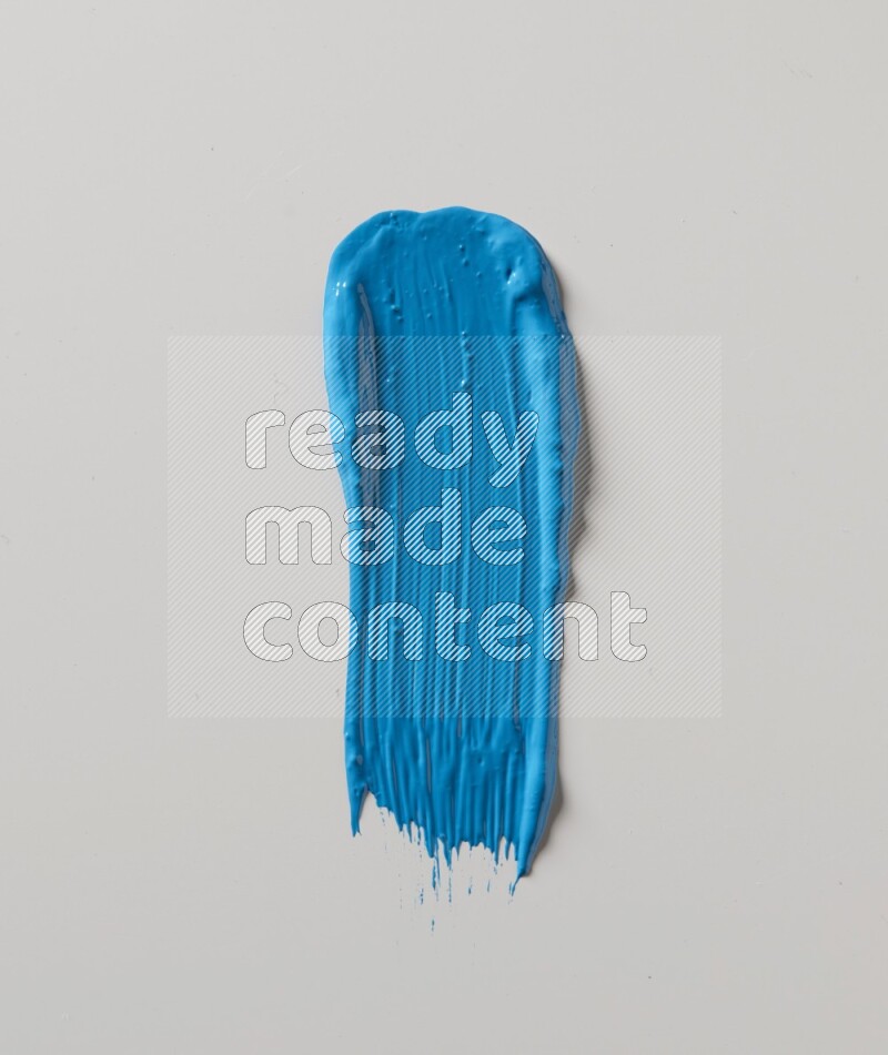 A single blue straight line brush stroke on a white background