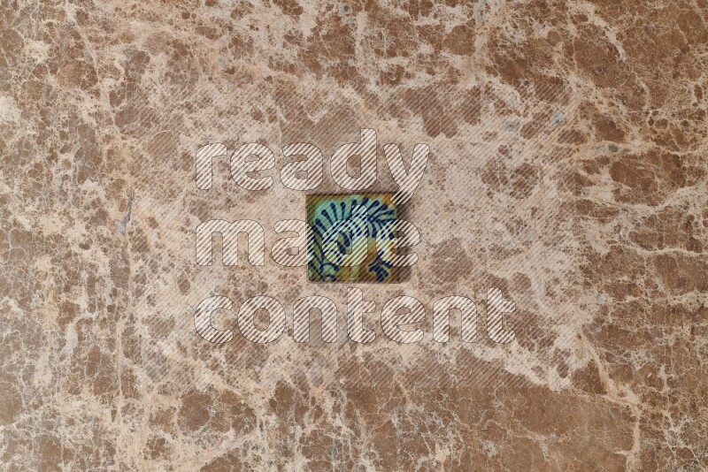 A decorative coaster on beige marble background