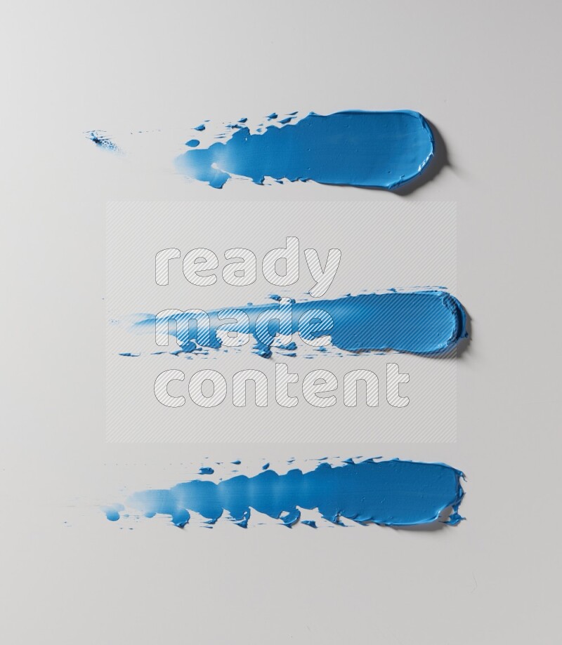 Blue painting knife strokes on white background