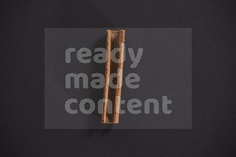 Cinnamon stick on black background