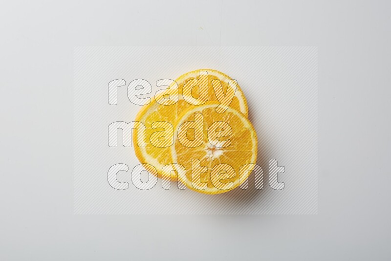 Three orange slices on a white background
