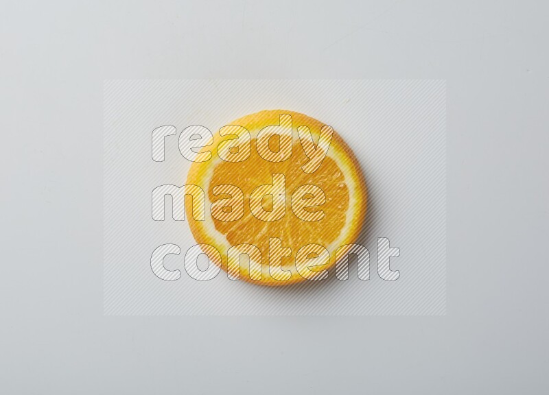 A Single orange slice on white background