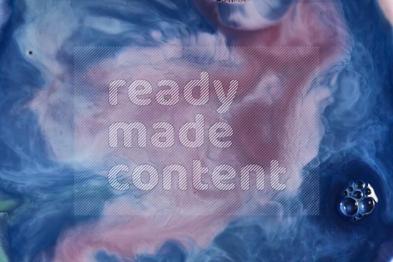 A close-up of abstract swirling patterns in blue, red and white