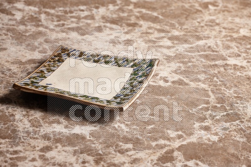 Decorative Pottery Plate on Beige Marble Flooring