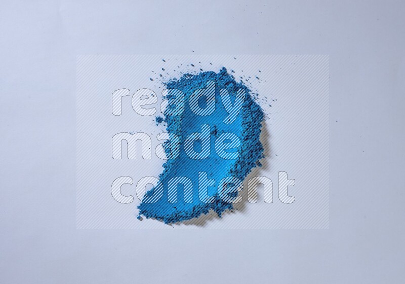 Blue powder smears on white background