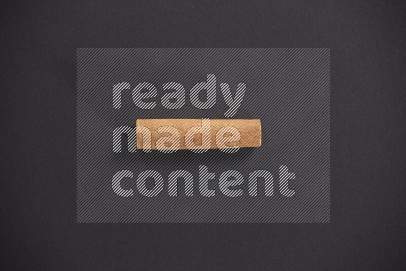 Cinnamon stick on black background