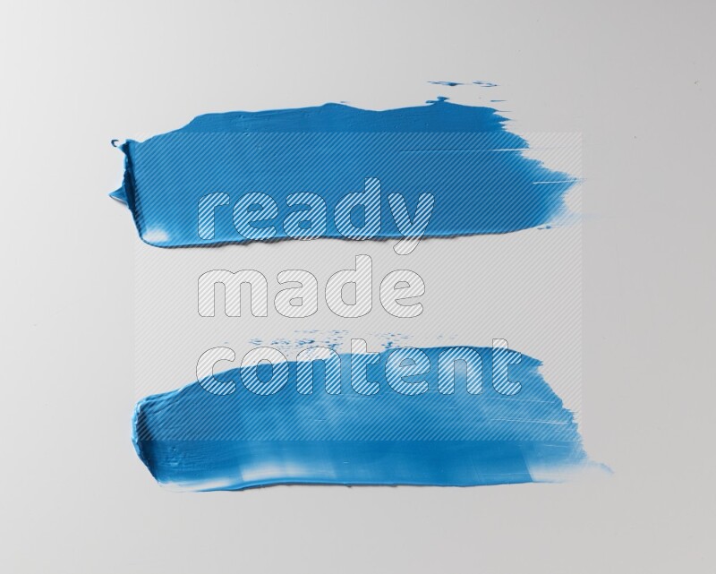 Blue painting knife strokes on white background