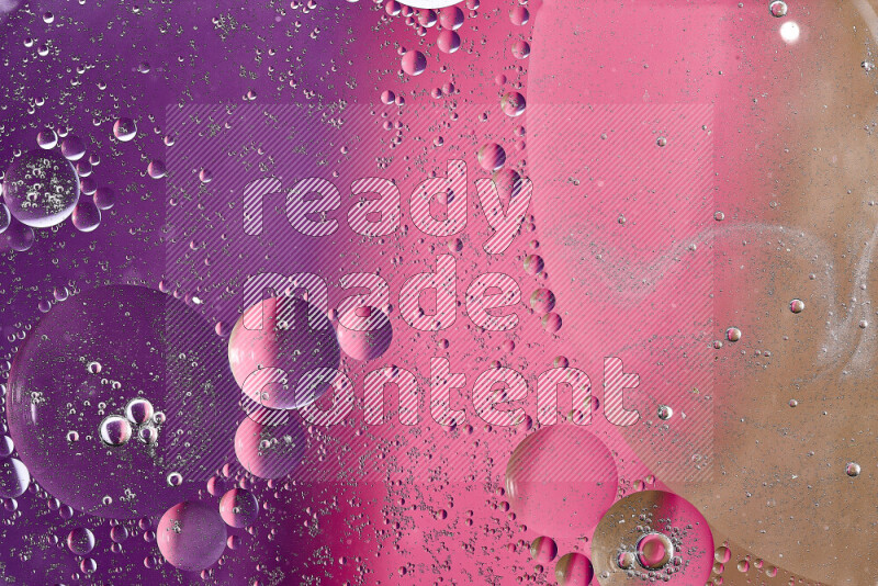Close-ups of abstract oil bubbles on water surface in shades of brown, purple and pink