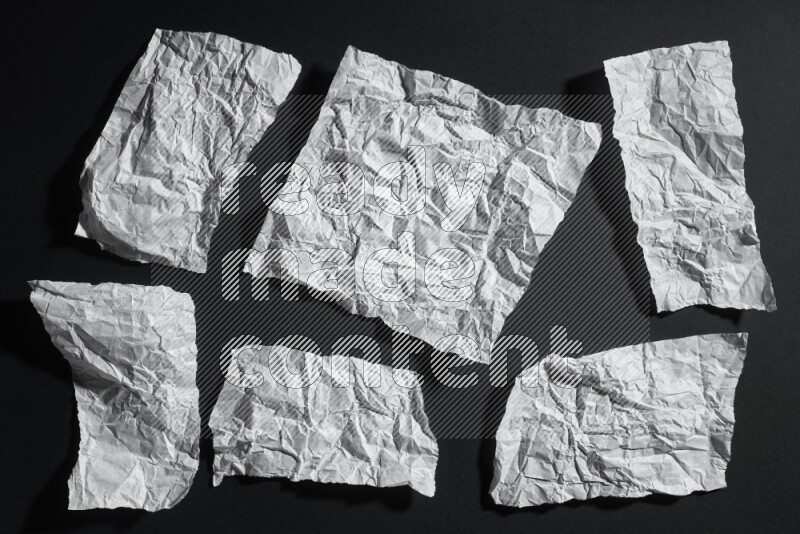 White paper sheet on black background