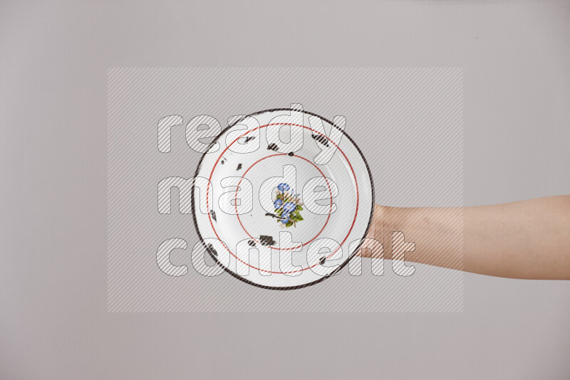 Woman hands holding different metal essentials in different positions