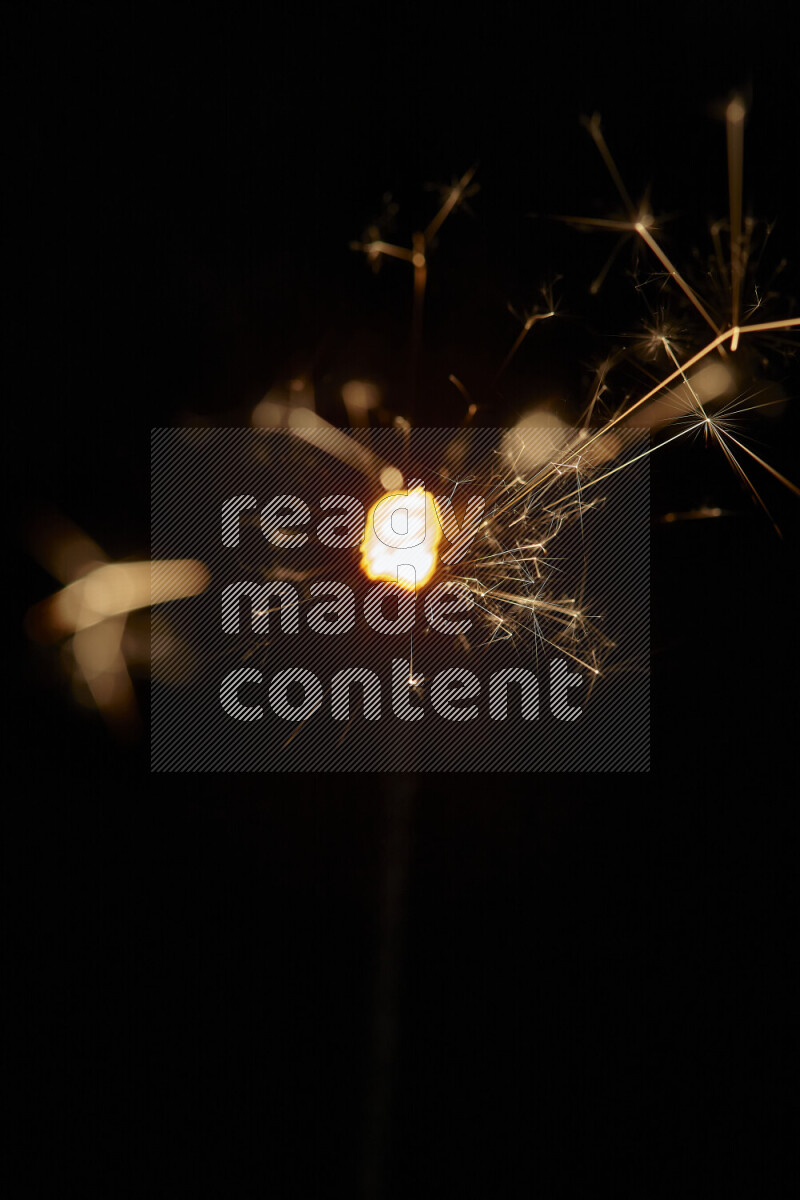 A close-up image of sparkler candle isolated on black background
