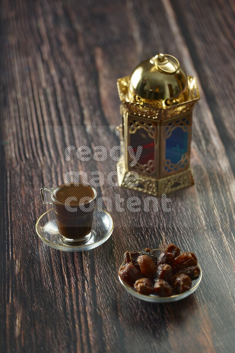A golden lantern with different drinks, dates, nuts, prayer beads and quran on brown wooden background
