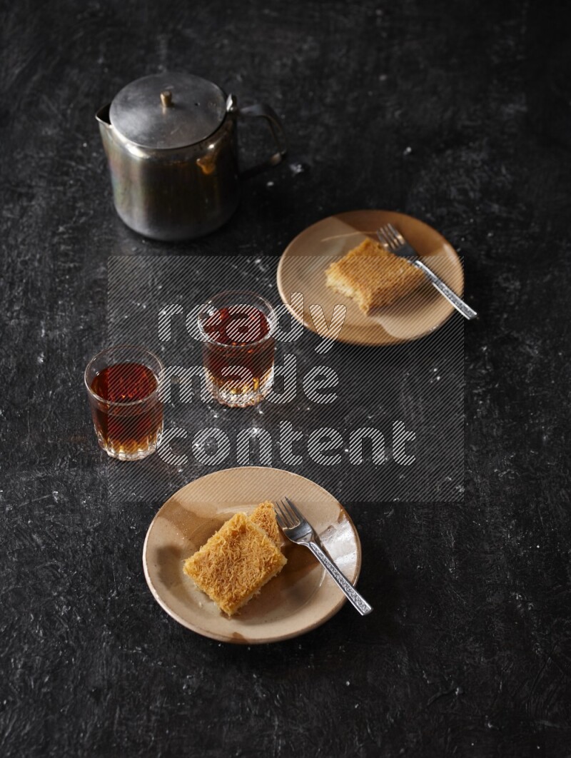 konafa with tea in a dark setup