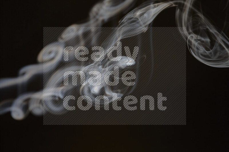 Motion of wavy smoke isolated on dark background