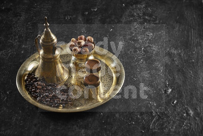 Dates with a drink on a metal tray in a dark setup