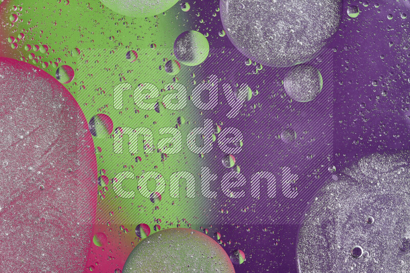 Close-ups of abstract oil bubbles on water surface in shades of purple, green and pink