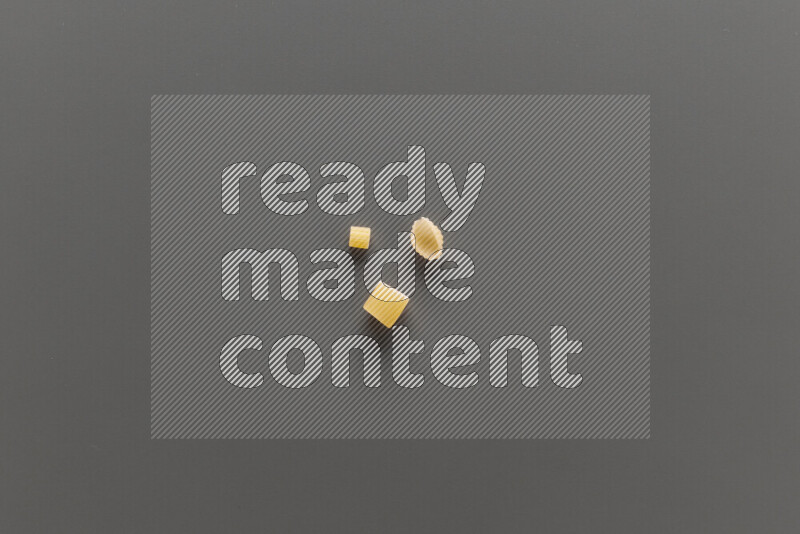 Different pasta types on grey background